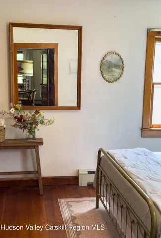 a view of bedroom with furniture and window