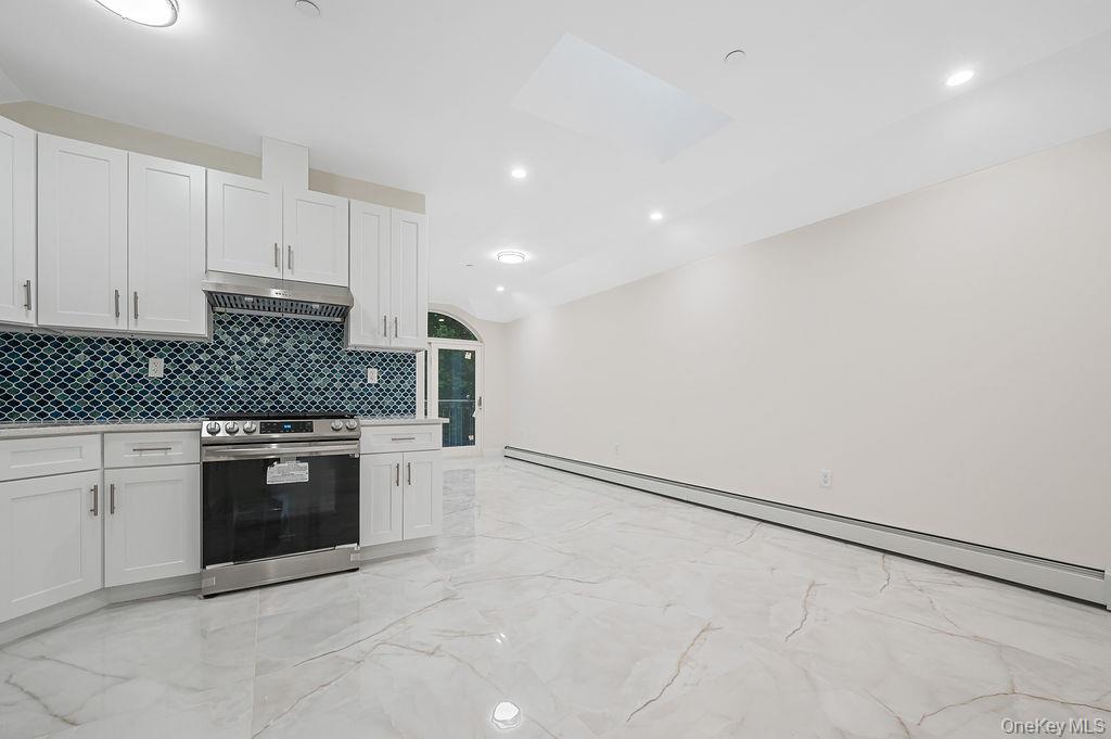 10603 49th Avenue Queens, NY 11368 - Photo 20 of 32 Kitchen with stainless steel appliances, a sink, light marble finish flooring, Italian costume designed glass splashback and recessed lighting