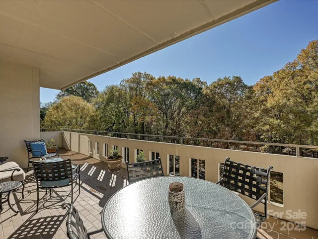 a view of balcony with wooden floor