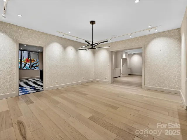 a kitchen with granite countertop stainless steel appliances a sink and counter space