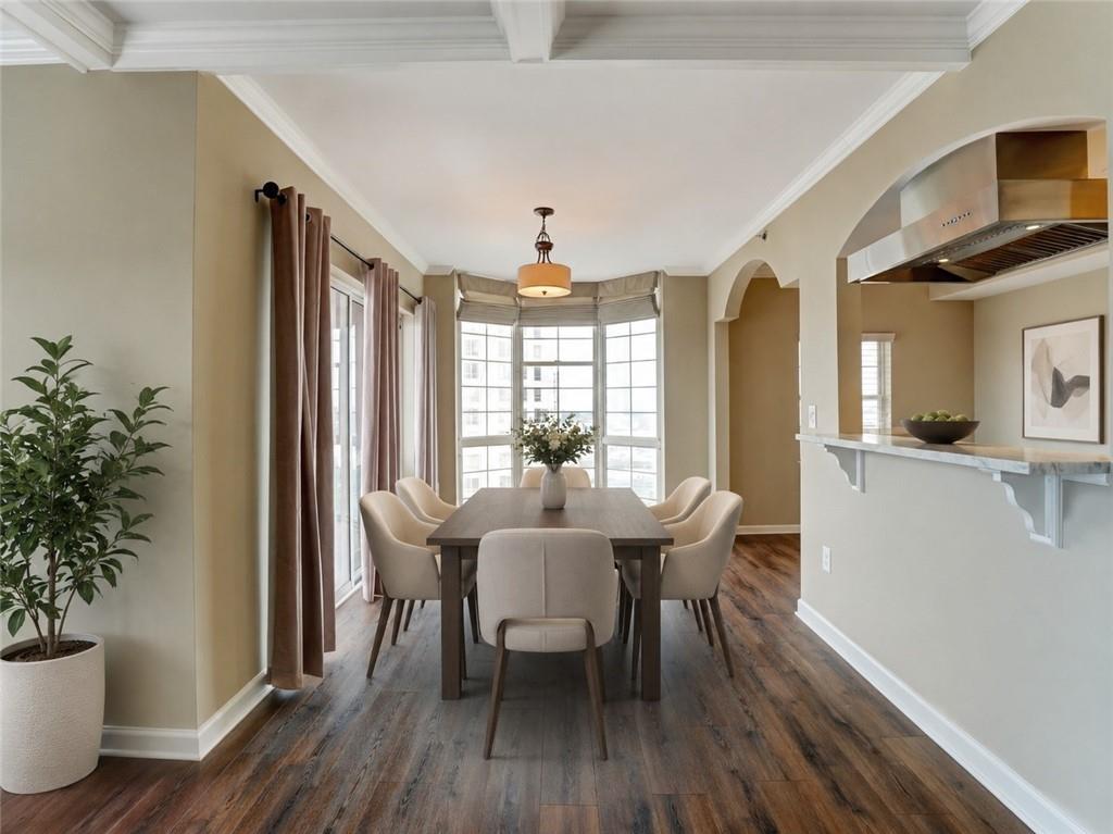 3435 Kingsboro Road Northeast, Unit 1601 Atlanta, GA 30326 - Photo 15 of 54 a view of a dining room with furniture window and wooden floor