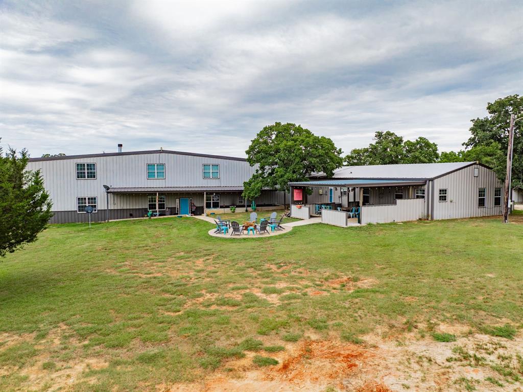 1990 Jim Harry Loop Sunset, TX 76270 - Photo 11 of 40 a view of a house with pool and a yard
