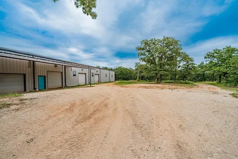 a living room with lots of furniture and kitchen