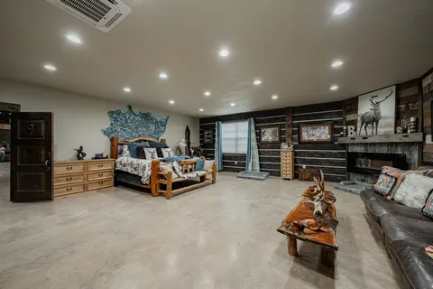 a bathroom with a bathtub shower sink and mirror