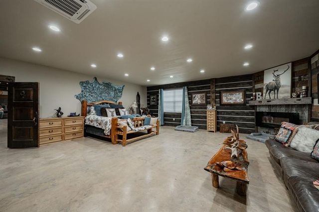 a bathroom with a bathtub shower sink and mirror