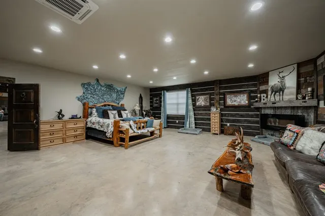 a bathroom with a bathtub shower sink and mirror