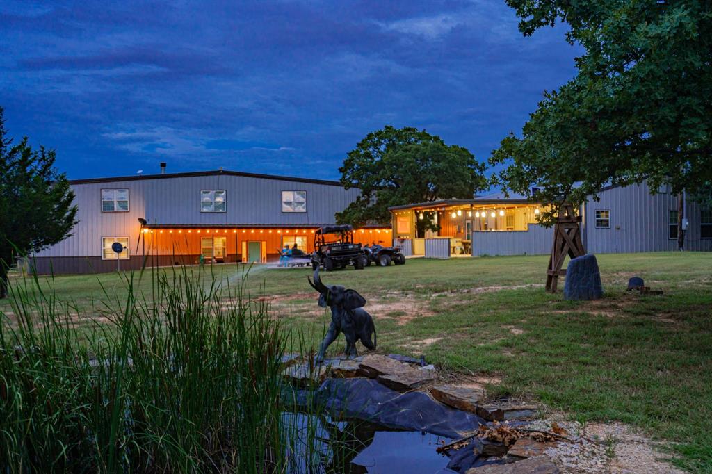 1990 Jim Harry Loop Sunset, TX 76270 - Photo 2 of 40 swimming pool view with a garden