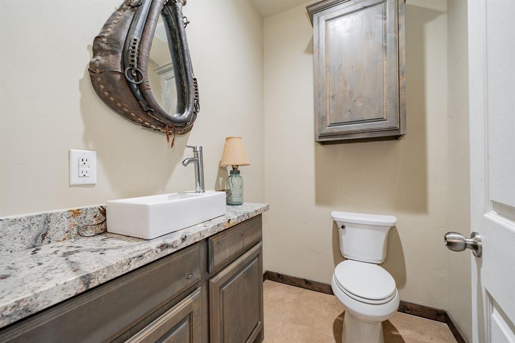 1990 Jim Harry Loop Sunset, TX 76270 - Photo 21 of 40 a bathroom with a toilet and a sink