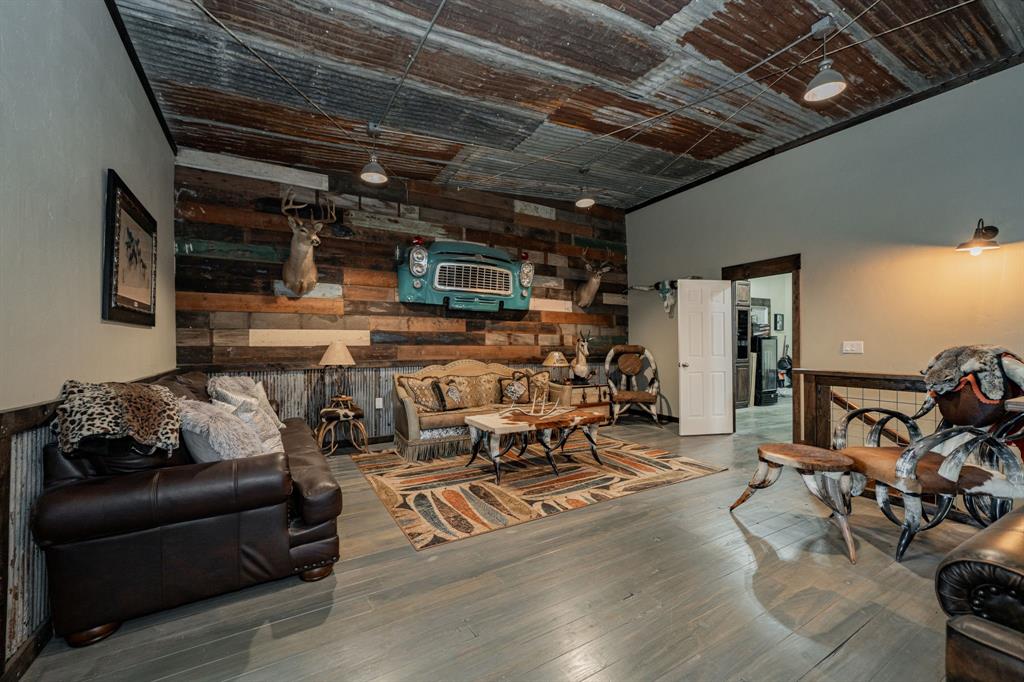 1990 Jim Harry Loop Sunset, TX 76270 - Photo 23 of 40 a living room with furniture and a flat screen tv