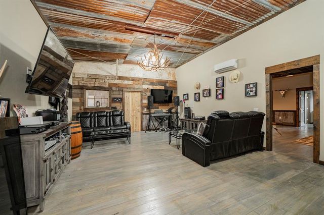 a roof deck with a couch and wooden floor