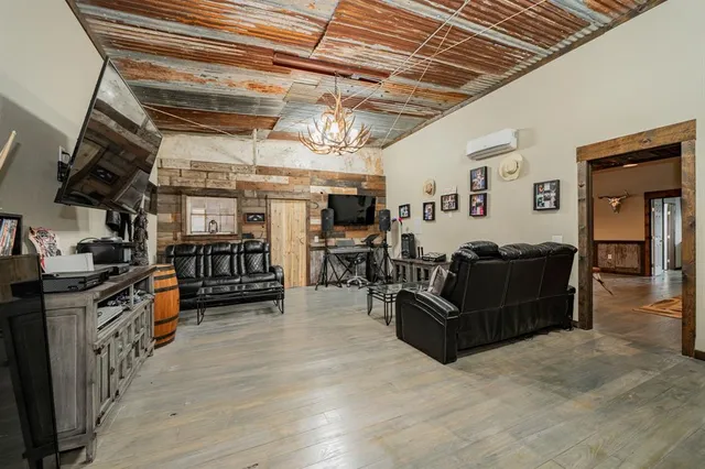 a roof deck with a couch and wooden floor