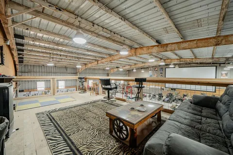 a living room with furniture and kitchen view