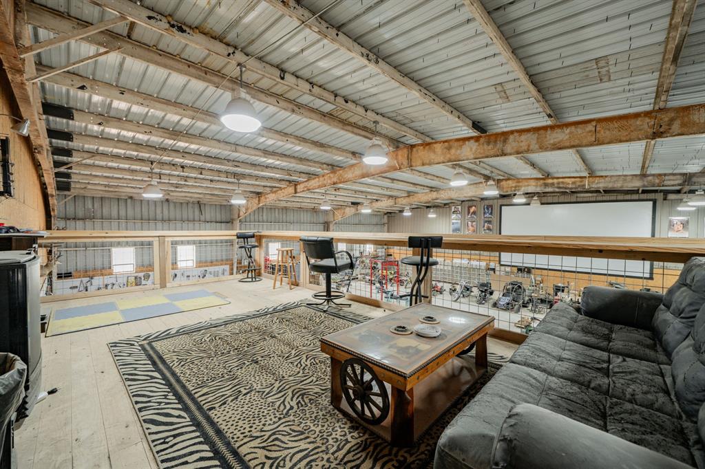 1990 Jim Harry Loop Sunset, TX 76270 - Photo 28 of 40 a roof deck with a couch and wooden floor