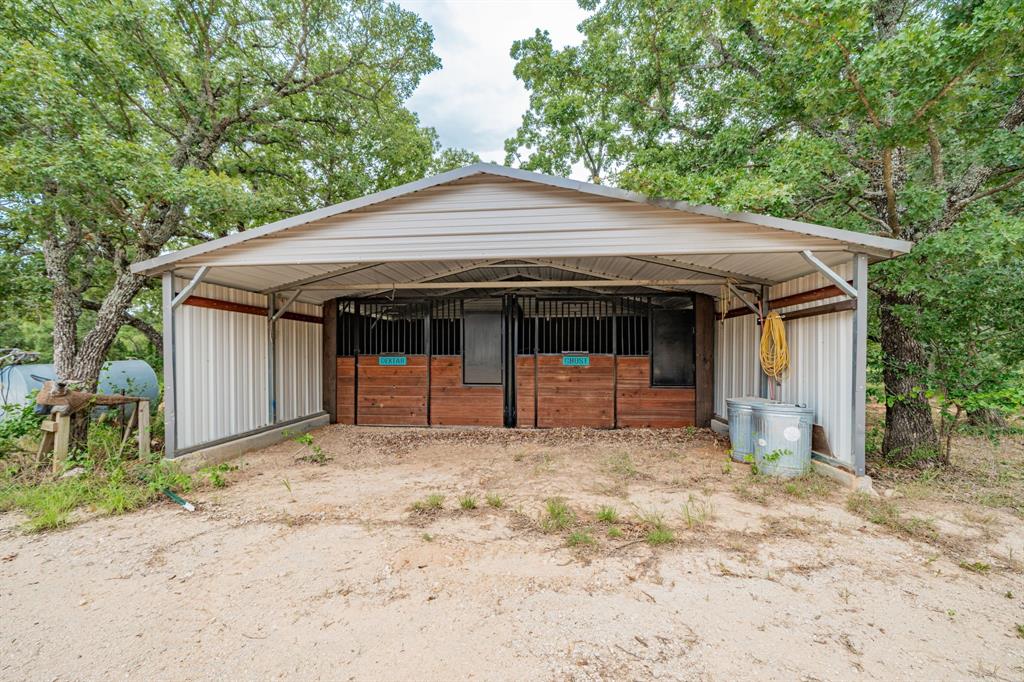 1990 Jim Harry Loop Sunset, TX 76270 - Photo 36 of 40 a front view of a house with a porch