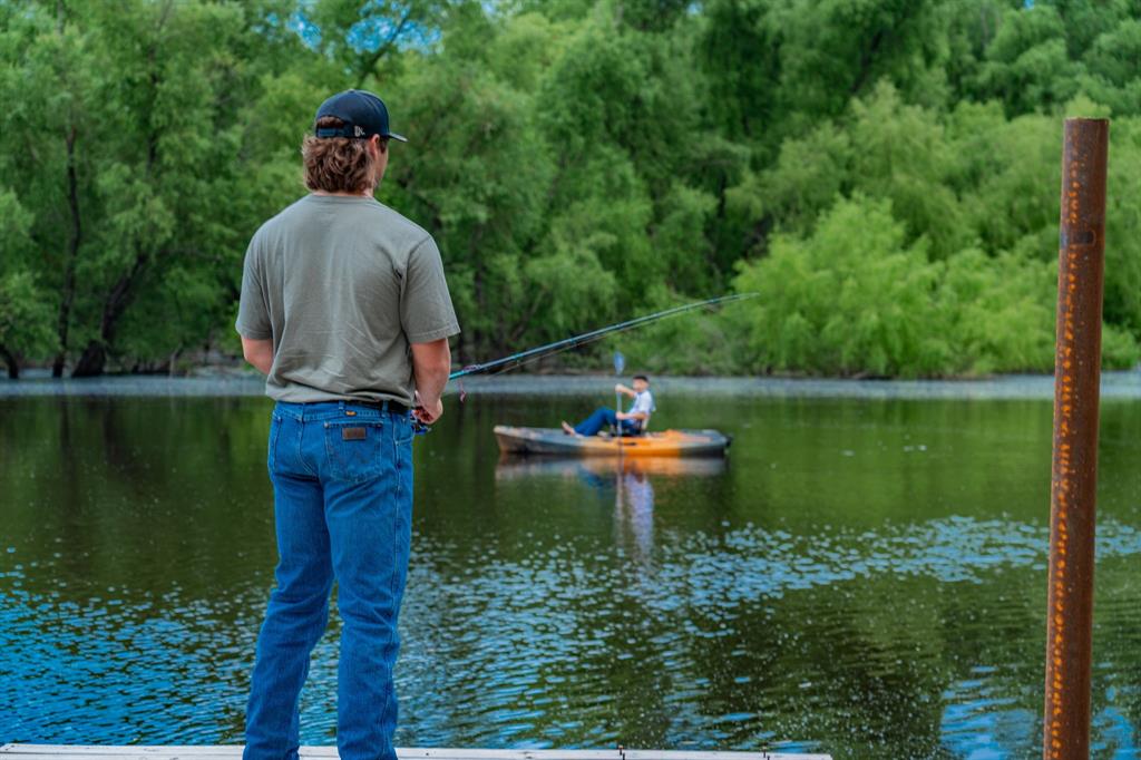 1990 Jim Harry Loop Sunset, TX 76270 - Photo 7 of 40 a swimming pool with a yard and outdoor seating
