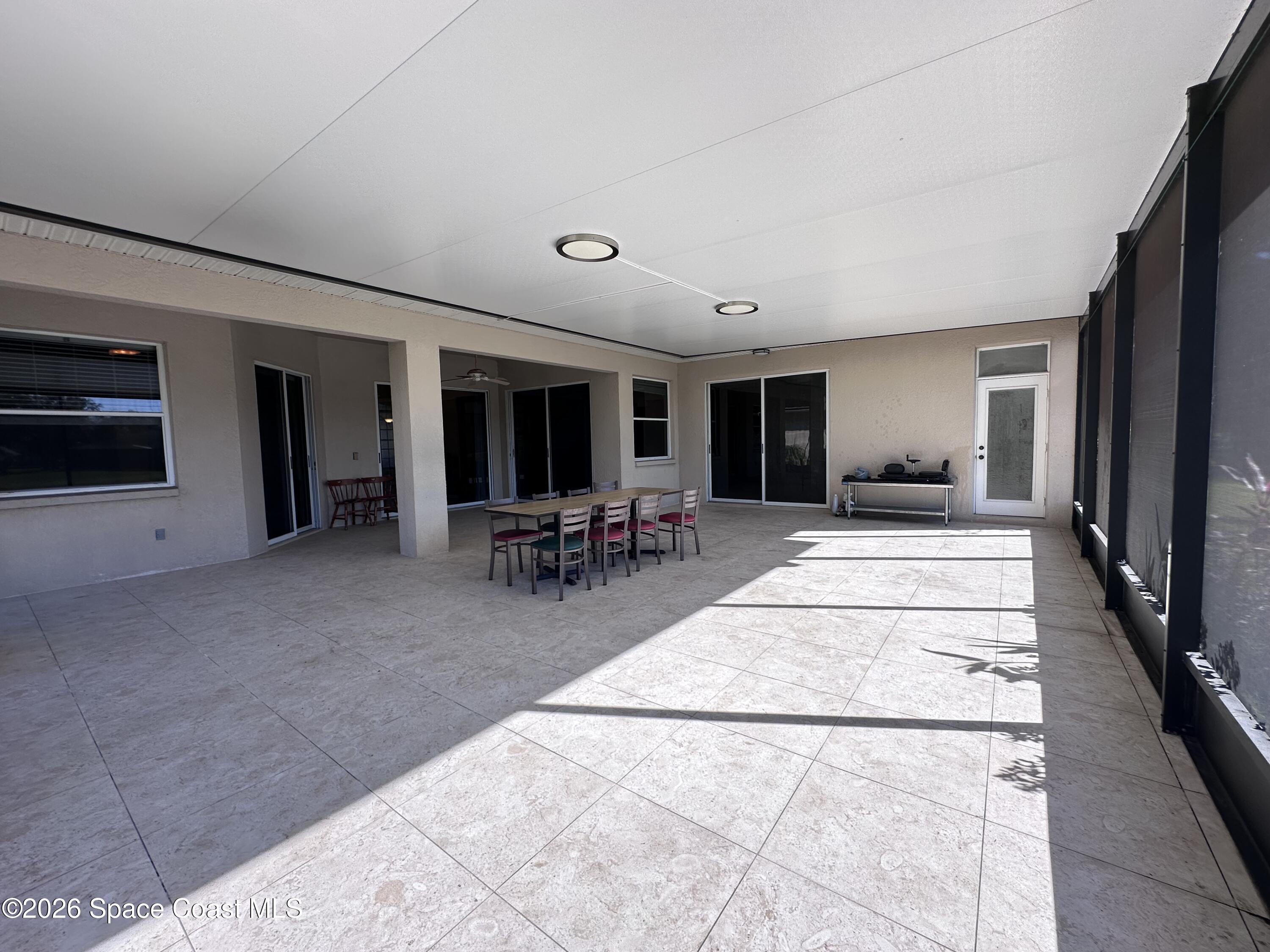 883 Spring Oak Drive Melbourne, FL 32901 - Photo 36 of 45 a lobby with furniture and a rug