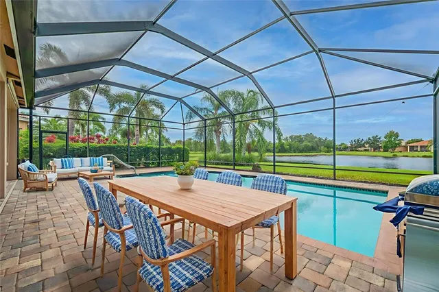 a view of a swimming pool with a patio