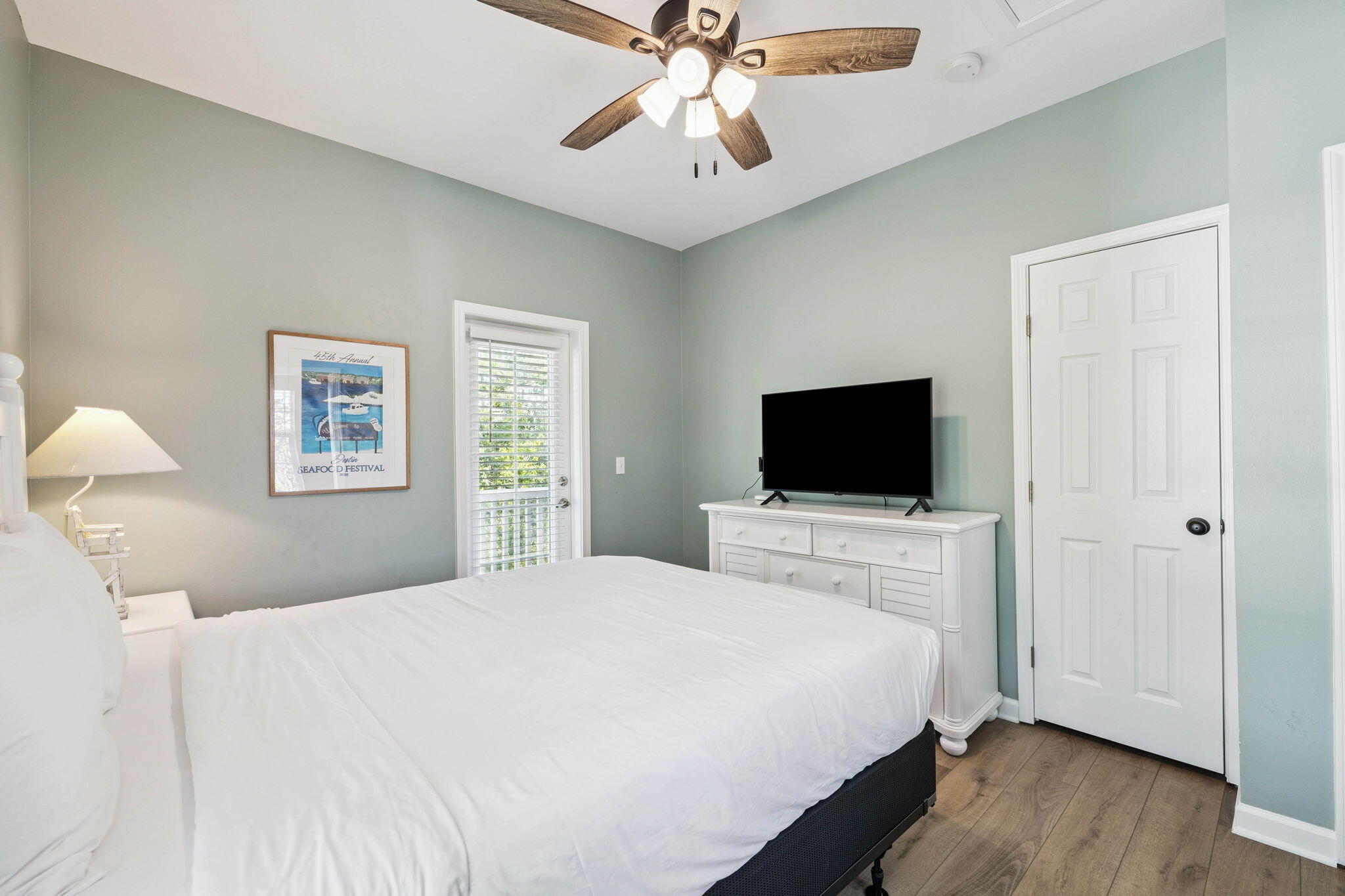 198 Somerset Bridge Road, Unit 114 Santa Rosa Beach, FL 32459 - Photo 18 of 28 a bedroom with a bed and a flat screen tv