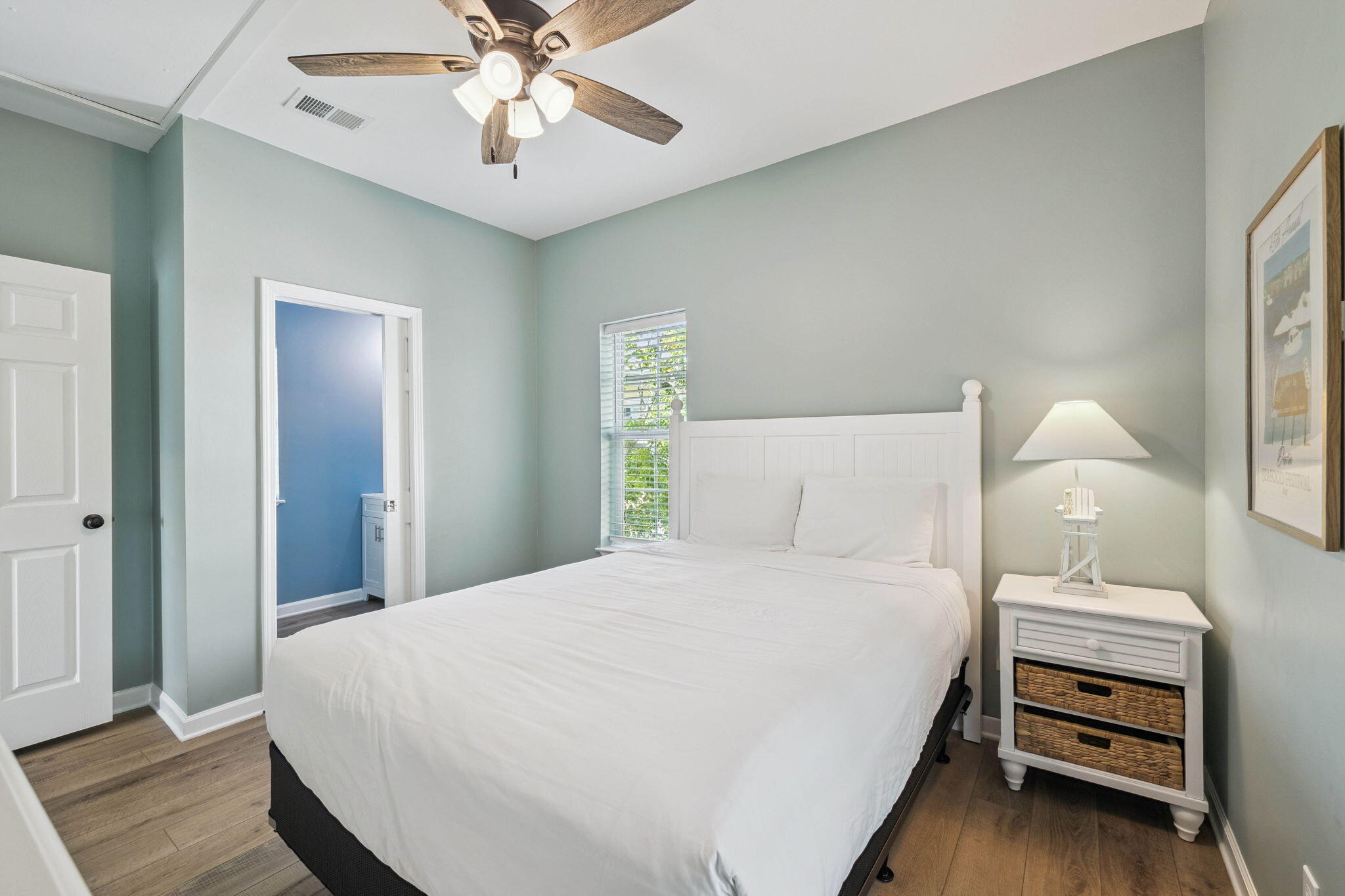 198 Somerset Bridge Road, Unit 114 Santa Rosa Beach, FL 32459 - Photo 19 of 28 a bedroom with a bed and a chandelier