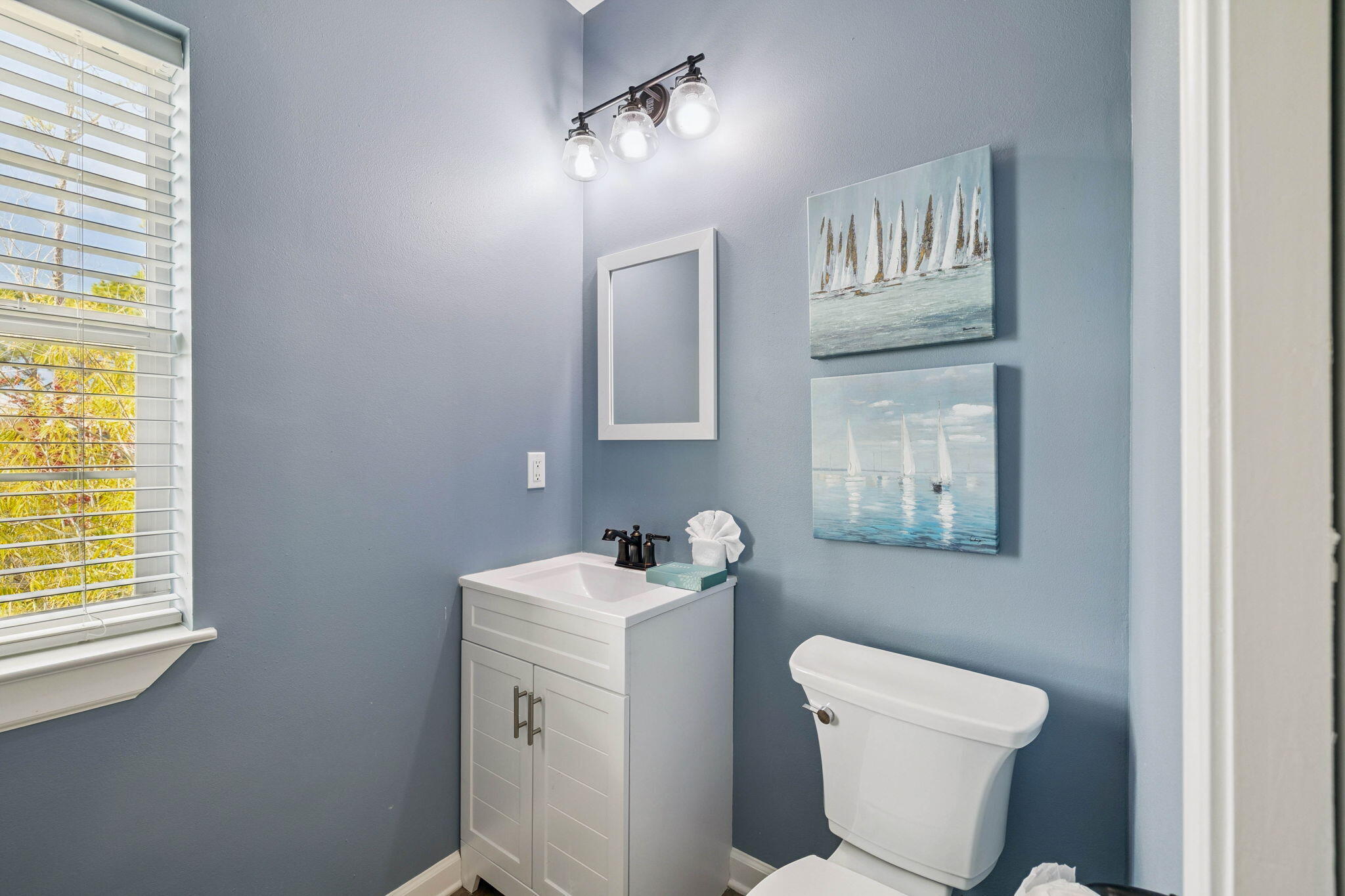 198 Somerset Bridge Road, Unit 114 Santa Rosa Beach, FL 32459 - Photo 20 of 28 a bathroom with a toilet a sink and a window