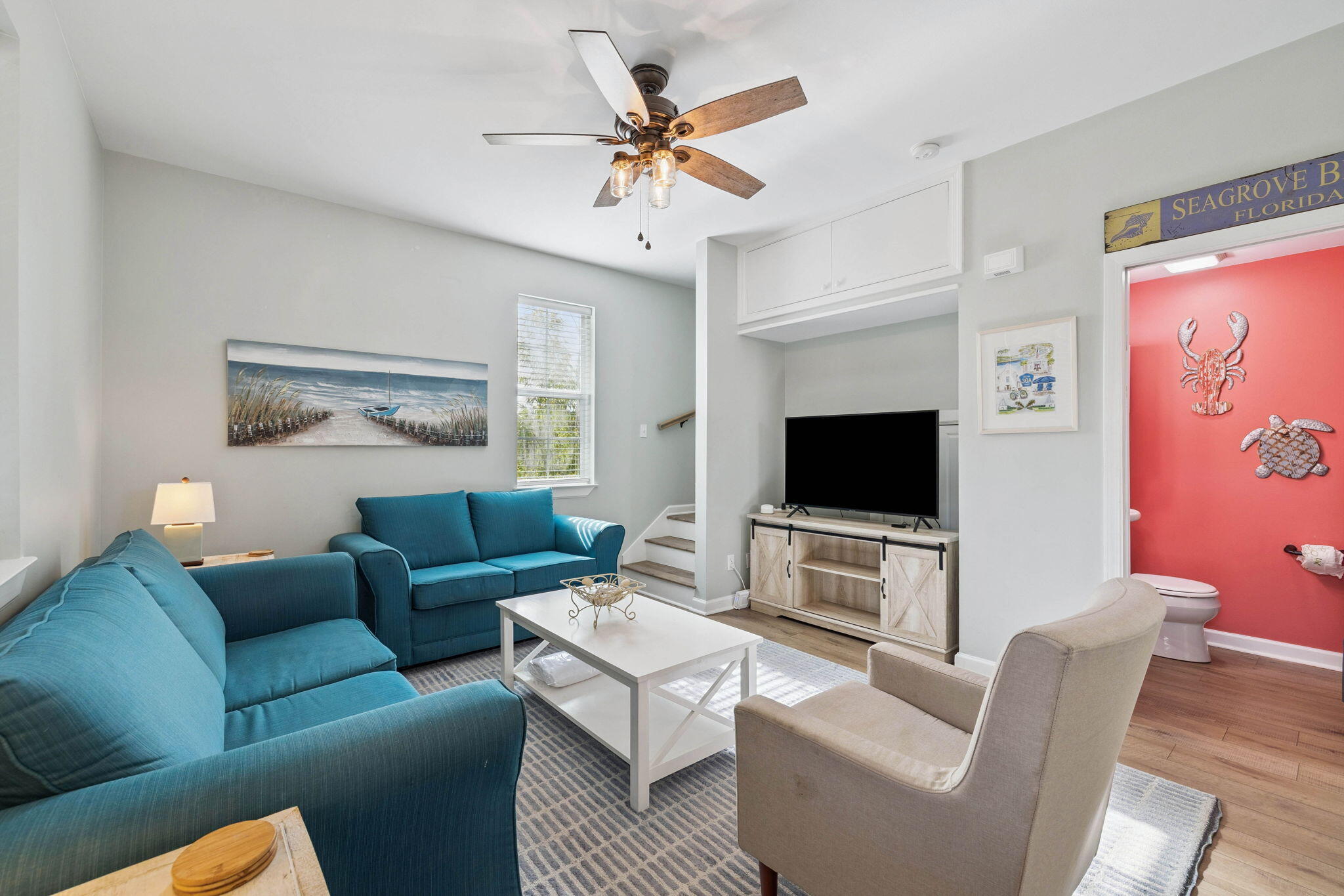 198 Somerset Bridge Road, Unit 114 Santa Rosa Beach, FL 32459 - Photo 2 of 28 a living room with furniture and a flat screen tv