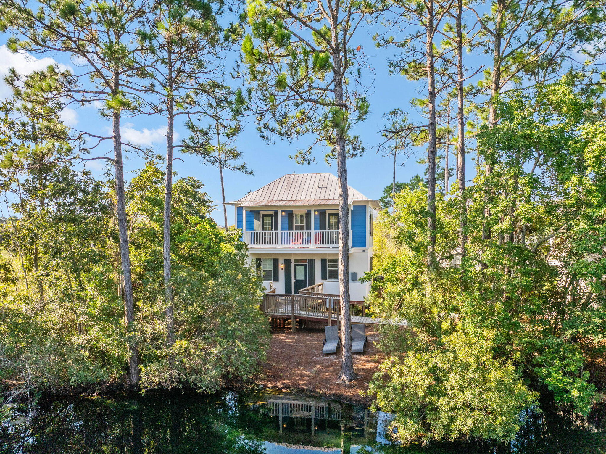 198 Somerset Bridge Road, Unit 114 Santa Rosa Beach, FL 32459 - Photo 26 of 28 a front view of a house with a garden