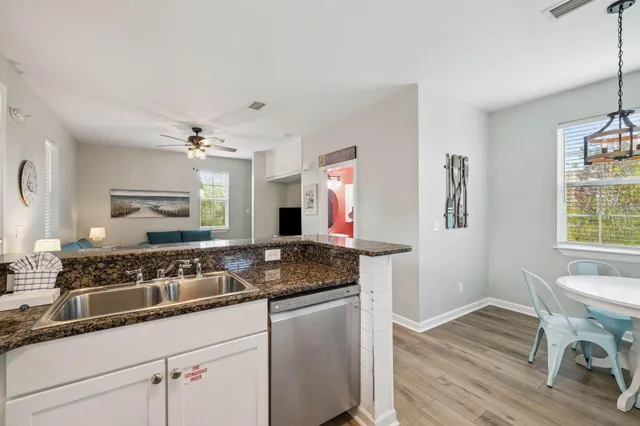a kitchen with a sink and wooden cabinets