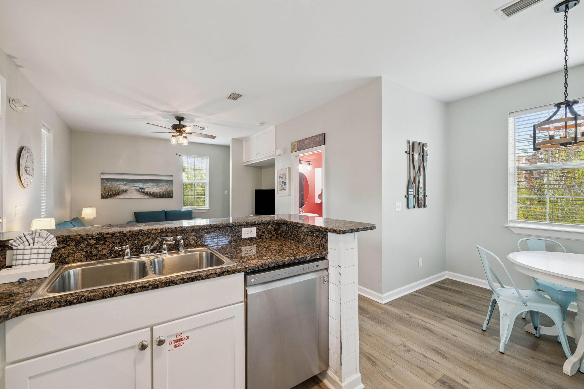 198 Somerset Bridge Road, Unit 114 Santa Rosa Beach, FL 32459 - Photo 7 of 28 a kitchen with a sink and wooden cabinets