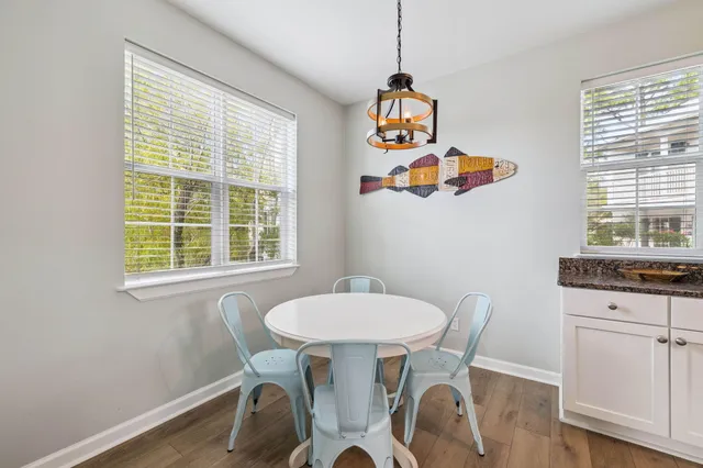 a dining room with a table and chairs