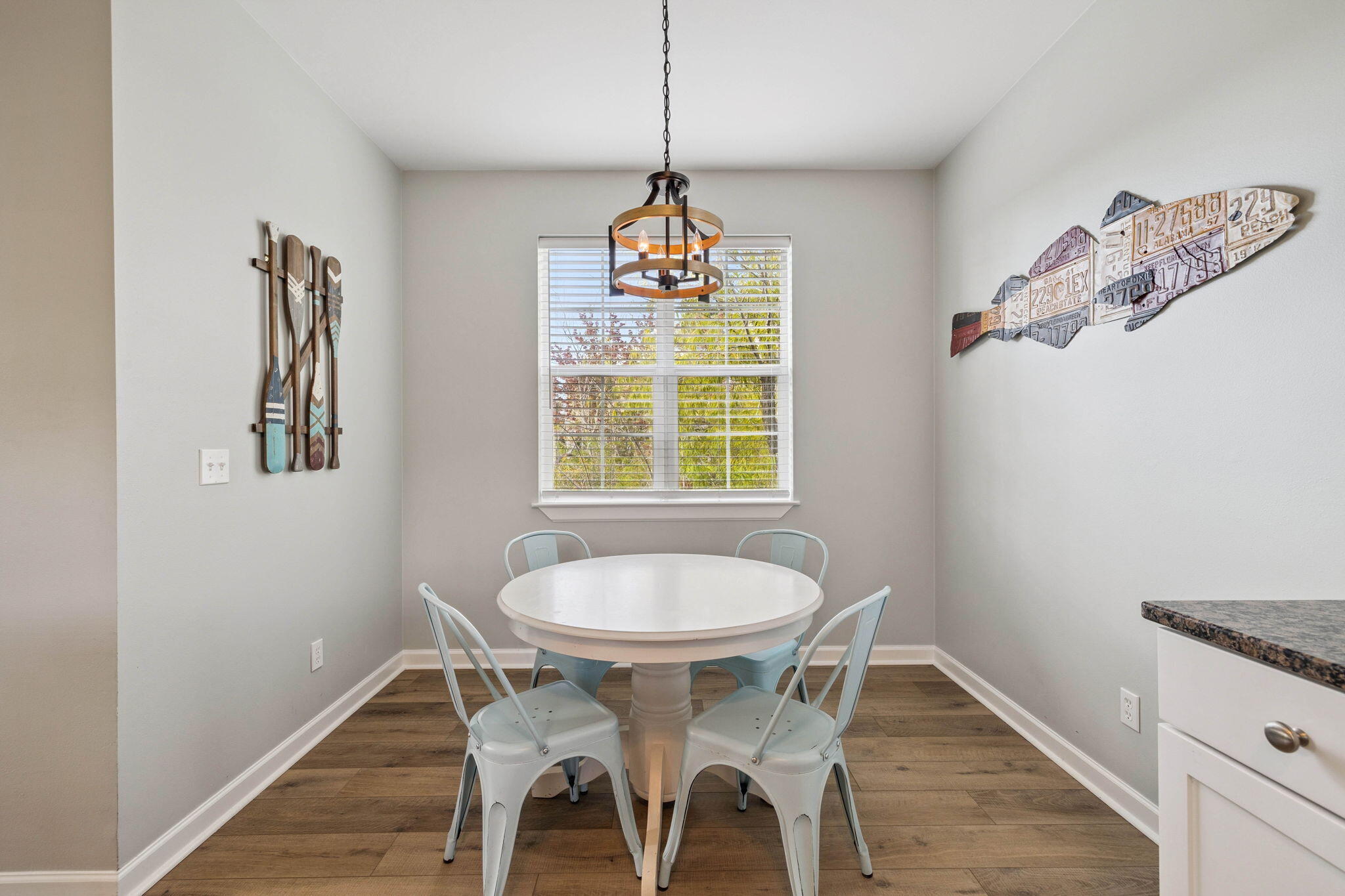 198 Somerset Bridge Road, Unit 114 Santa Rosa Beach, FL 32459 - Photo 10 of 28 a dining room with chandelier and wooden floor