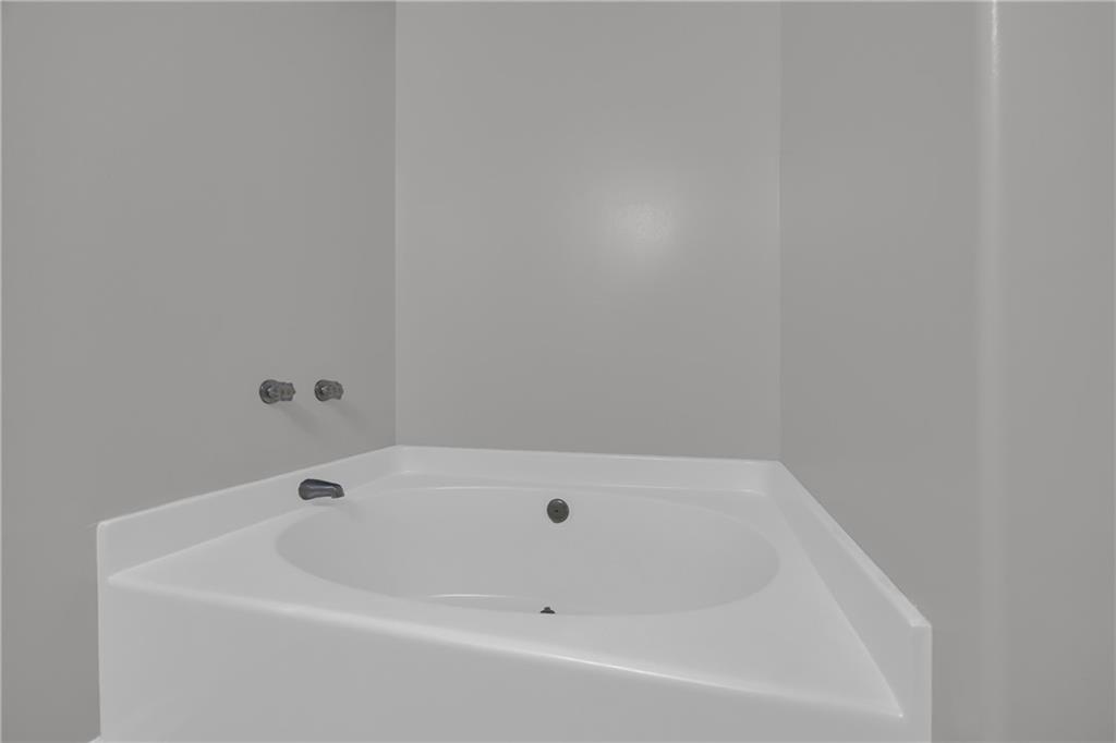 1498 Box Circle Winder, GA 30680 - Photo 37 of 56 a white bath tub sitting in a bathroom