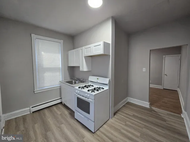 a kitchen with a stove and a microwave