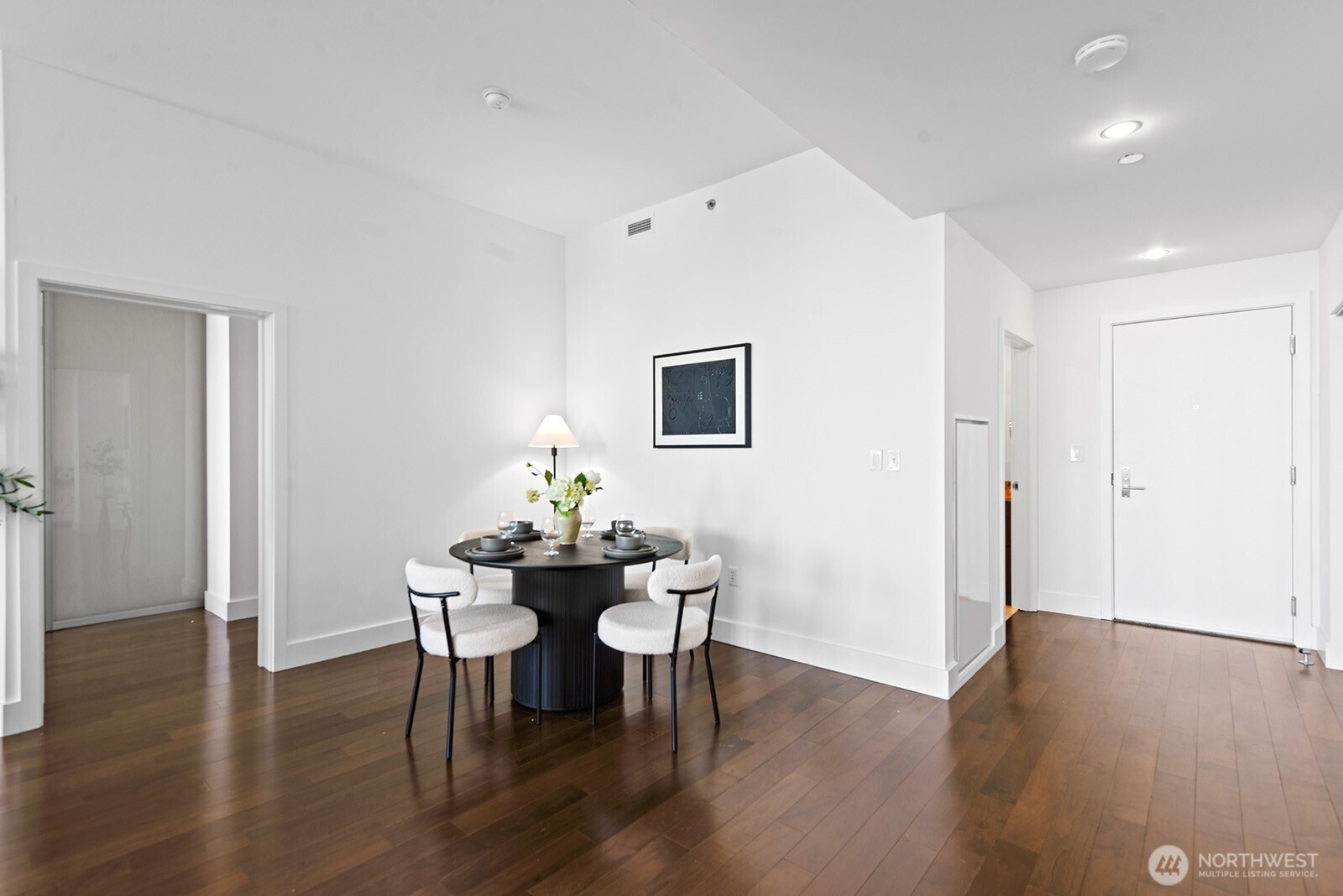 737 Olive Way, Unit 3509 Seattle, WA 98101 - Photo 14 of 31 a view of a dining room with furniture and wooden floor