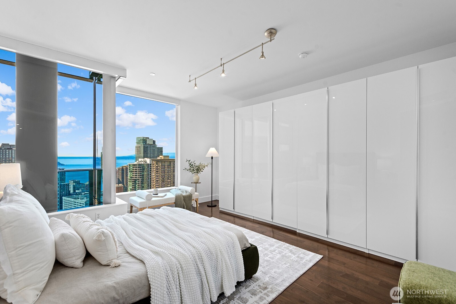 737 Olive Way, Unit 3509 Seattle, WA 98101 - Photo 16 of 31 a bedroom with a bed and a window