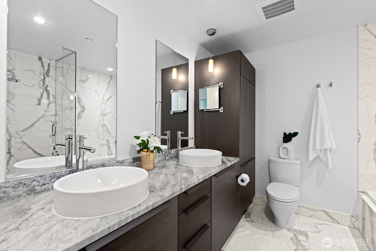 737 Olive Way, Unit 3509 Seattle, WA 98101 - Photo 18 of 31 a bathroom with a granite countertop double vanity sink toilet and shower