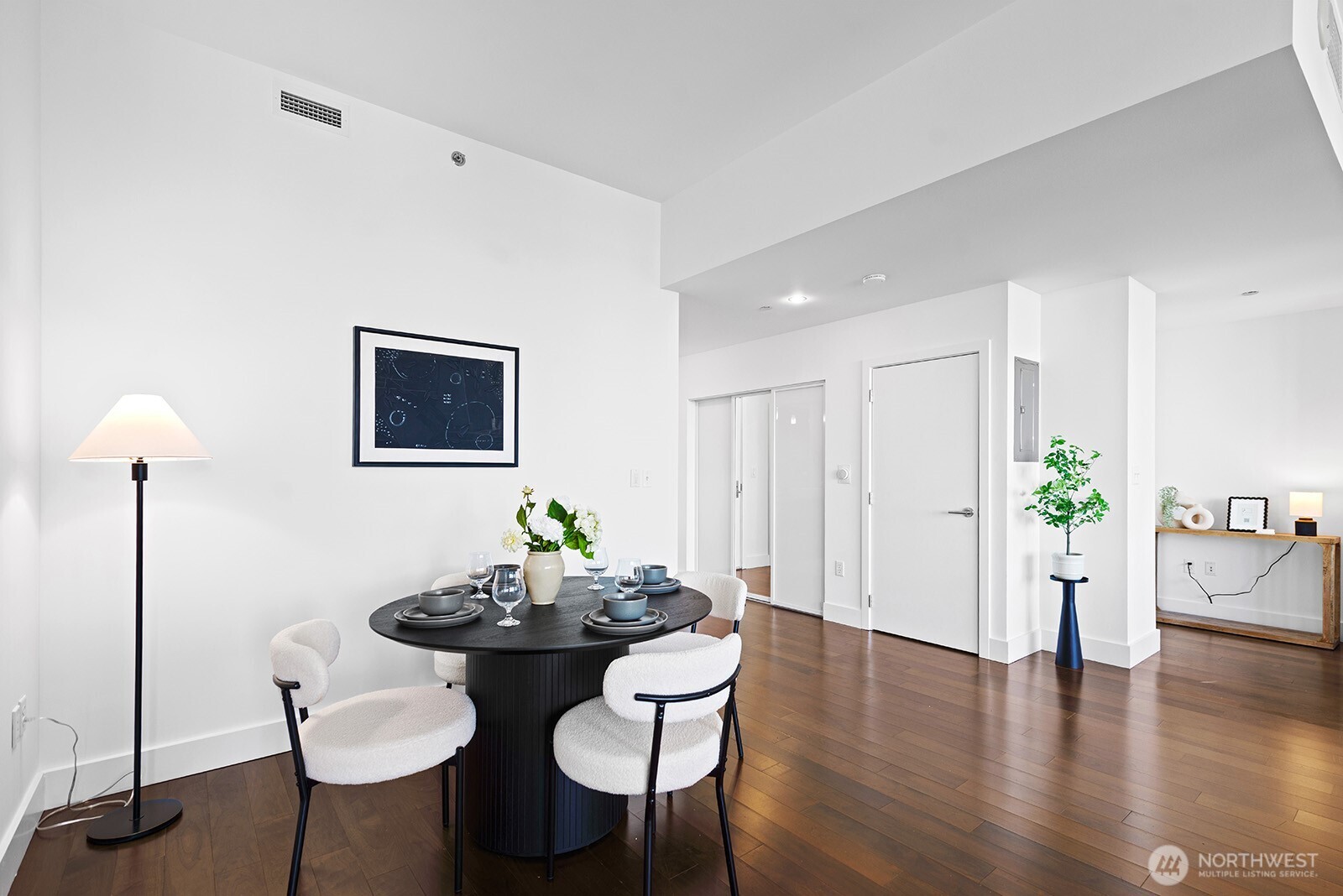 737 Olive Way, Unit 3509 Seattle, WA 98101 - Photo 20 of 31 a view of a dining room with furniture and wooden floor