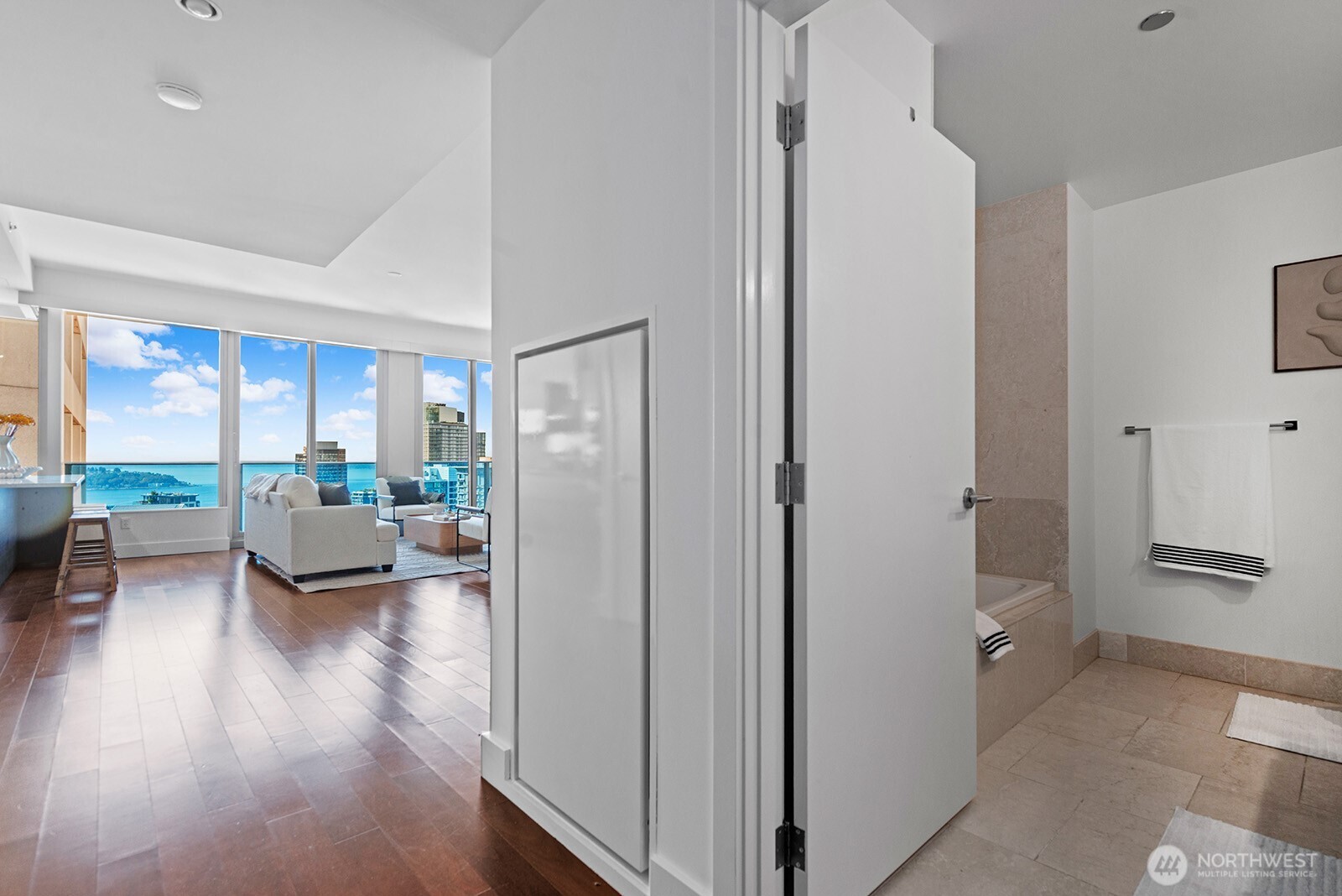 737 Olive Way, Unit 3509 Seattle, WA 98101 - Photo 23 of 31 a view of living room with furniture and a wooden floor