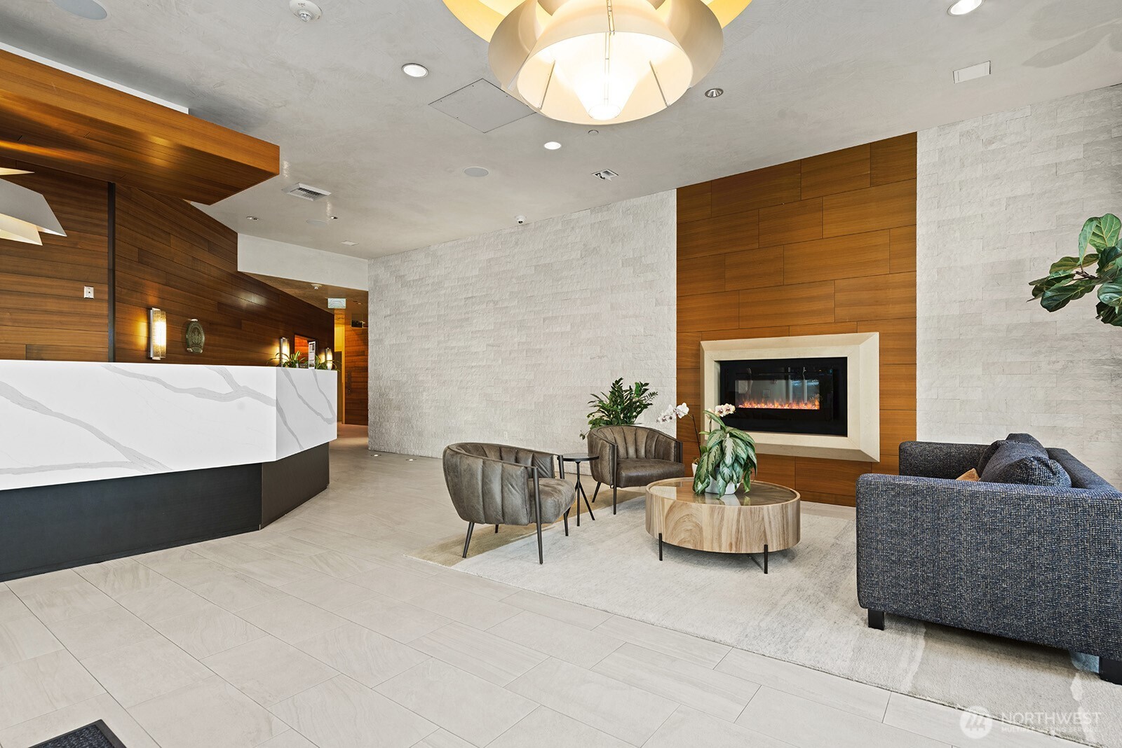 737 Olive Way, Unit 3509 Seattle, WA 98101 - Photo 25 of 31 a living room with furniture and a fireplace