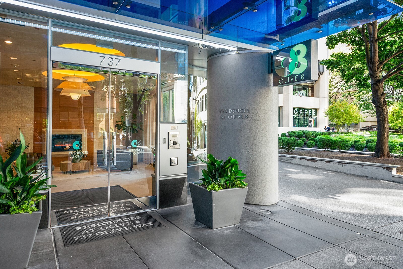 737 Olive Way, Unit 3509 Seattle, WA 98101 - Photo 29 of 31 a view of a porch with potted plants