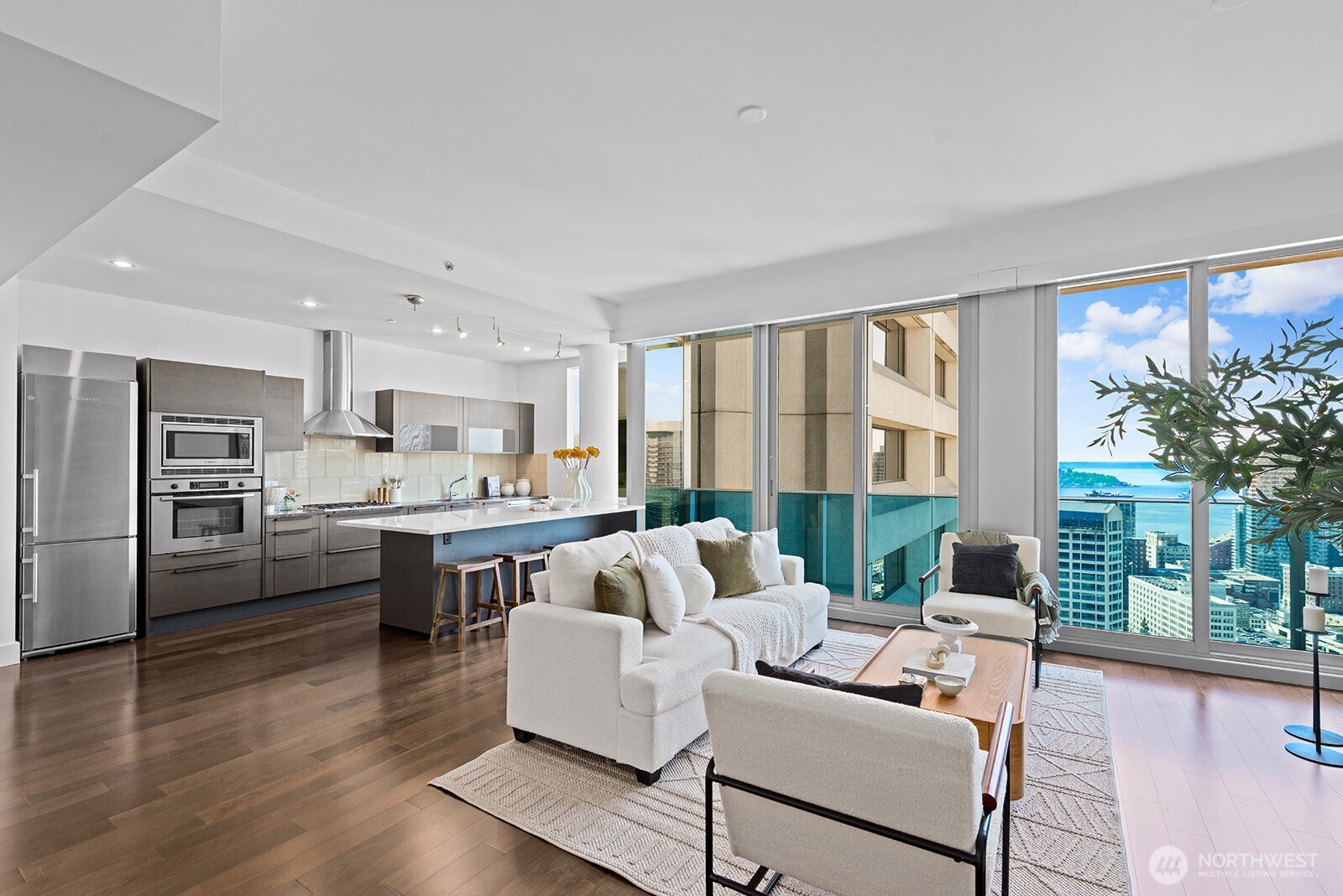 737 Olive Way, Unit 3509 Seattle, WA 98101 - Photo 9 of 31 a living room with furniture and a large window