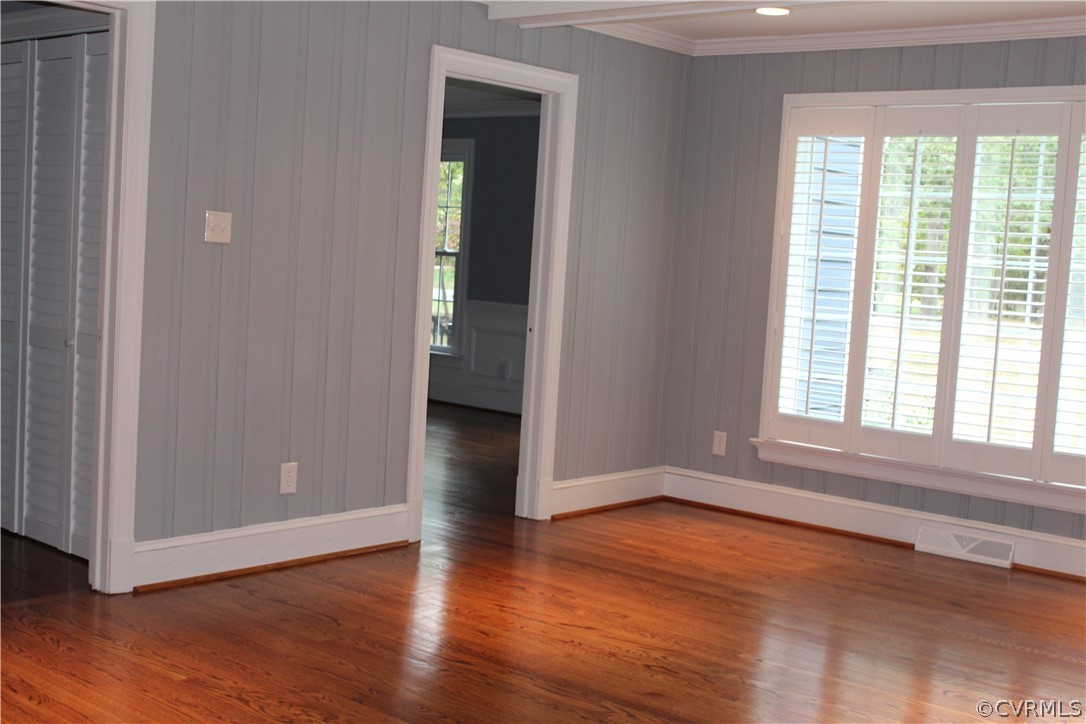 13621 Thorngate Road Midlothian, VA 23113 - Photo 22 of 46 a view of an empty room with wooden floor and a window