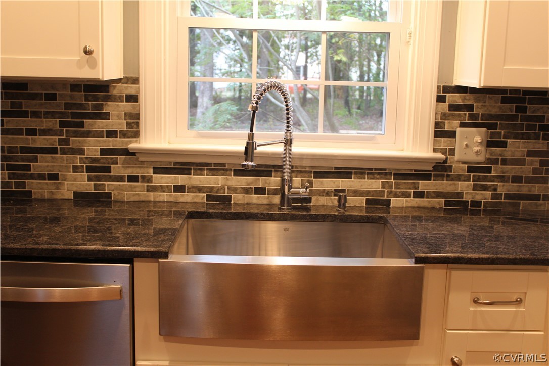 13621 Thorngate Road Midlothian, VA 23113 - Photo 30 of 46 a view of a kitchen counter top a sink and a window