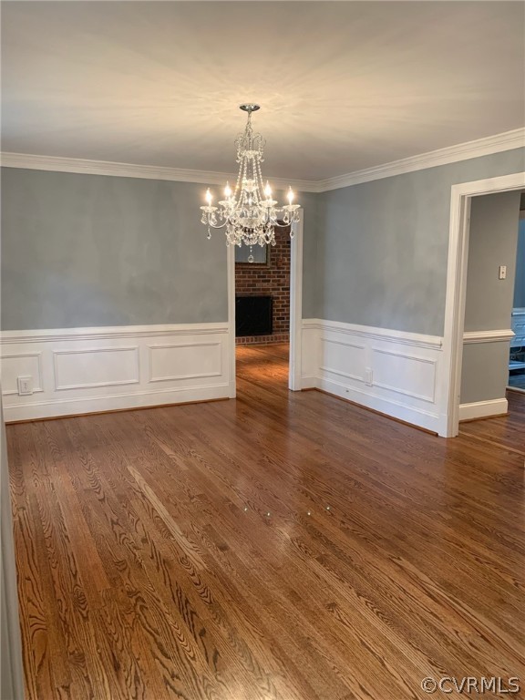 13621 Thorngate Road Midlothian, VA 23113 - Photo 32 of 46 a view of a room with wooden floor chandelier and windows