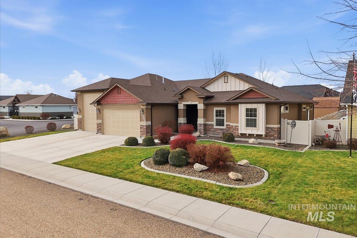4604 Middlesboro Way Caldwell, ID 83607 - Photo 2 of 43 Craftsman-style house featuring stone siding, driveway, and a garage