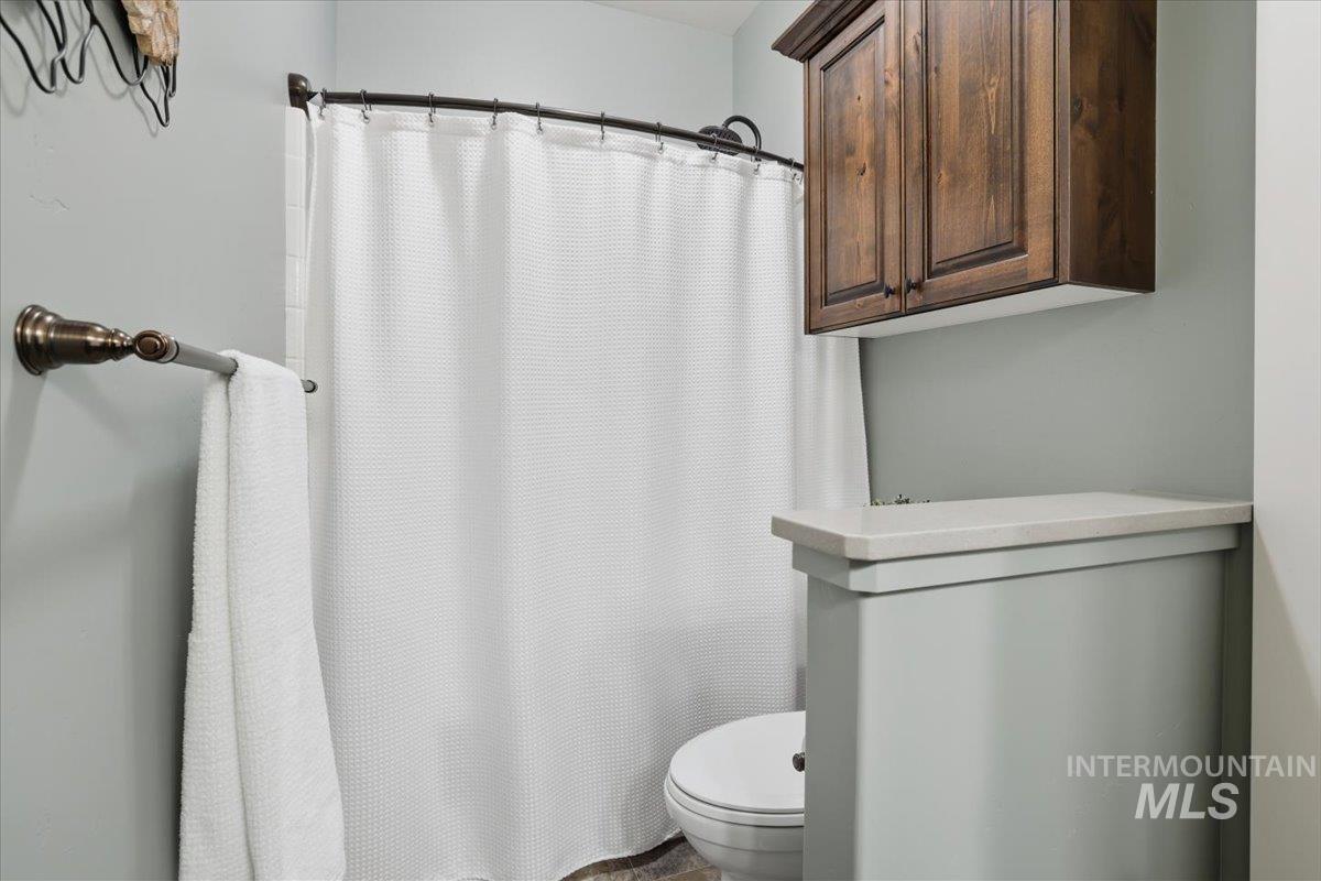 4604 Middlesboro Way Caldwell, ID 83607 - Photo 24 of 43 Bathroom with a shower with curtain and toilet