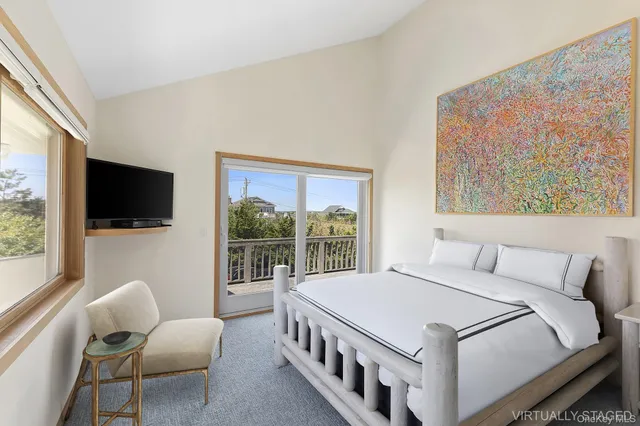 a bedroom with a bed and couch