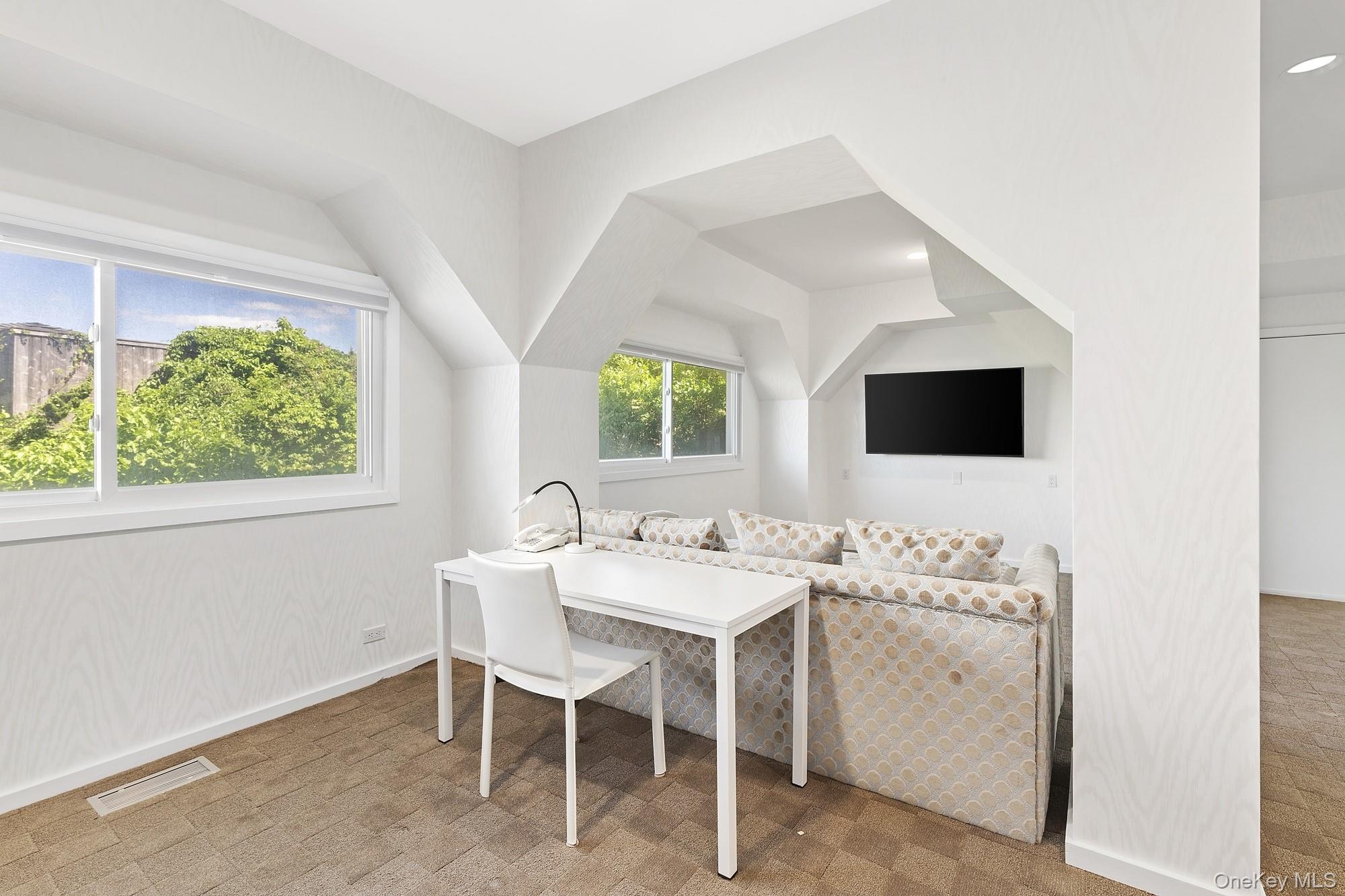 63-65 Dune Road Quogue, NY 11959 - Photo 18 of 29 a view of a dining room with furniture and window