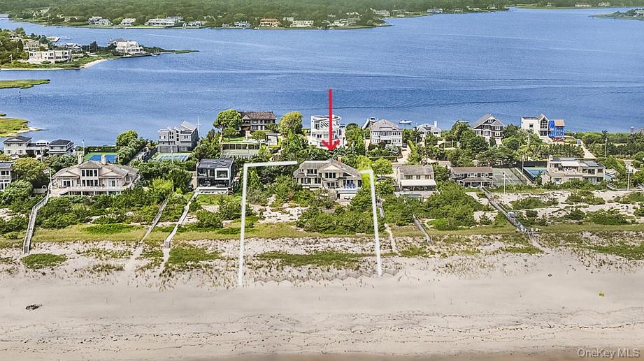 63-65 Dune Road Quogue, NY 11959 - Photo 2 of 29 a backyard of a house