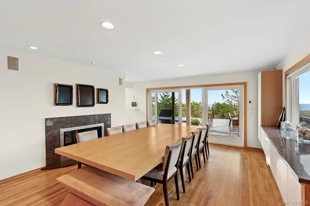 a view of a dining room with furniture window and wooden floor