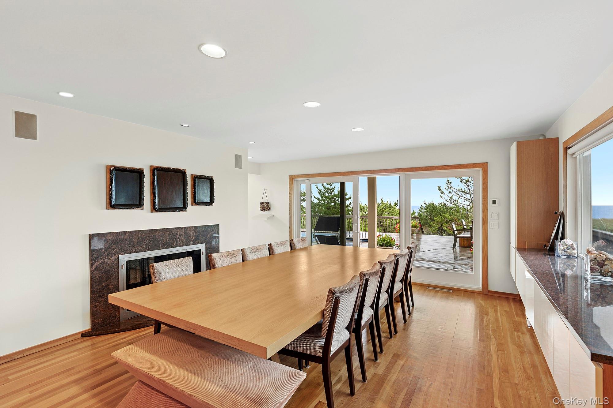 63-65 Dune Road Quogue, NY 11959 - Photo 7 of 29 a view of a dining room with furniture window and wooden floor